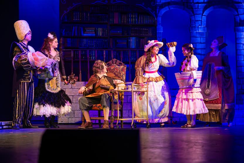 Actors perform onstage
